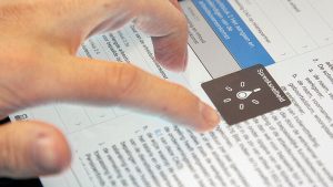 Close-up of a visually impaired employee using the CLA app